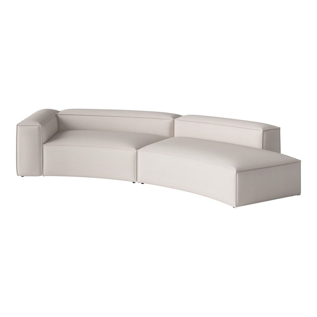 Curved sectional sofa in soft, light gray upholstery with smooth, minimalist design and subtle texture.