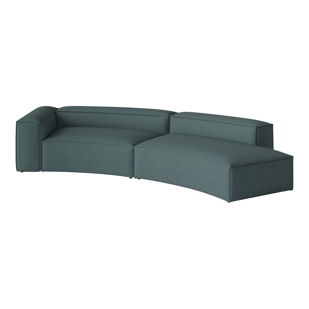 Teal upholstered sectional sofa with a contemporary, curved design and textured fabric for modern decor.