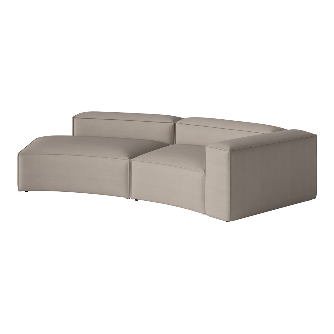 Stylish curved sofa in a soft beige fabric, featuring a modern, minimalist design. Perfect for any contemporary space.