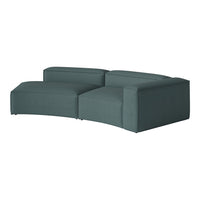 Textured teal sectional sofa with modern curved design, perfect for contemporary living spaces.