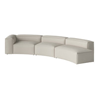 Curved sectional sofa in a soft beige color with a sleek, minimalist design and smooth leather upholstery.