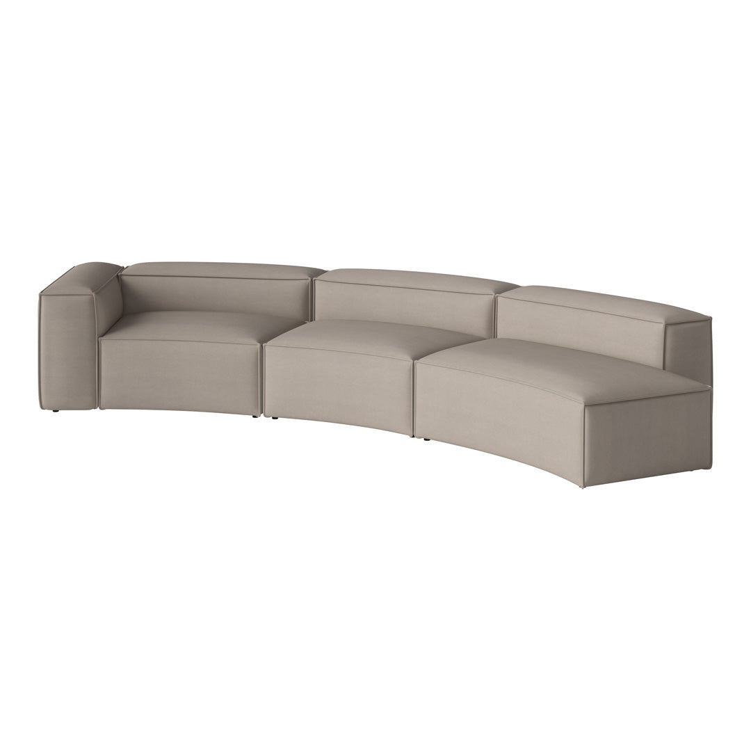 Curved sofa in soft beige fabric with smooth, minimalist design. Perfect for modern living spaces.