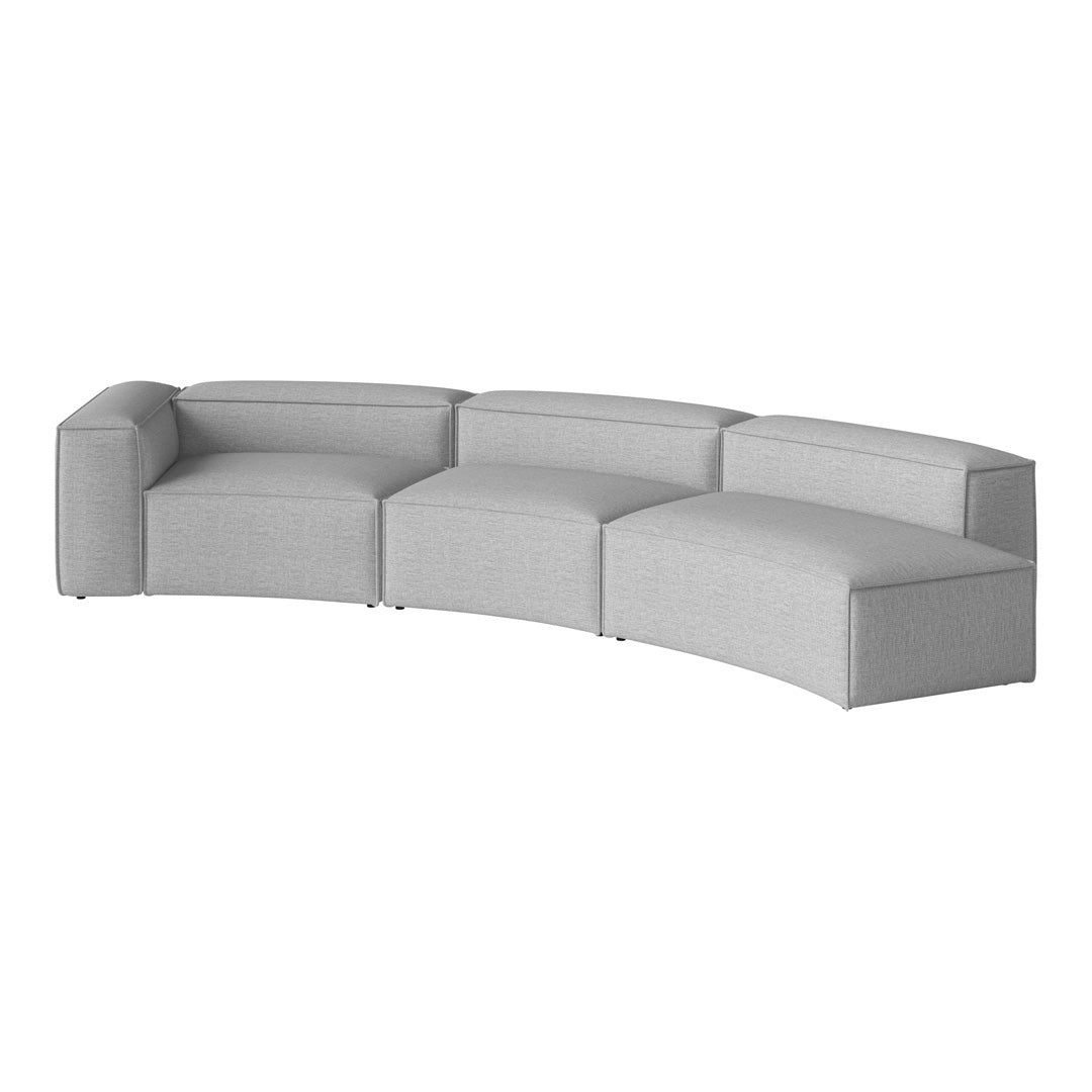 Curved grey sectional sofa with a textured fabric and minimalist design. Perfect for modern living spaces.