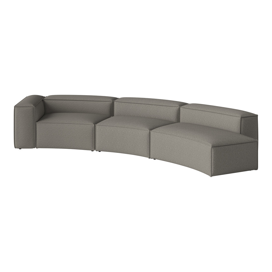 Curved gray couch with a textured pattern, featuring smooth, minimalist design elements. Perfect for modern interiors.