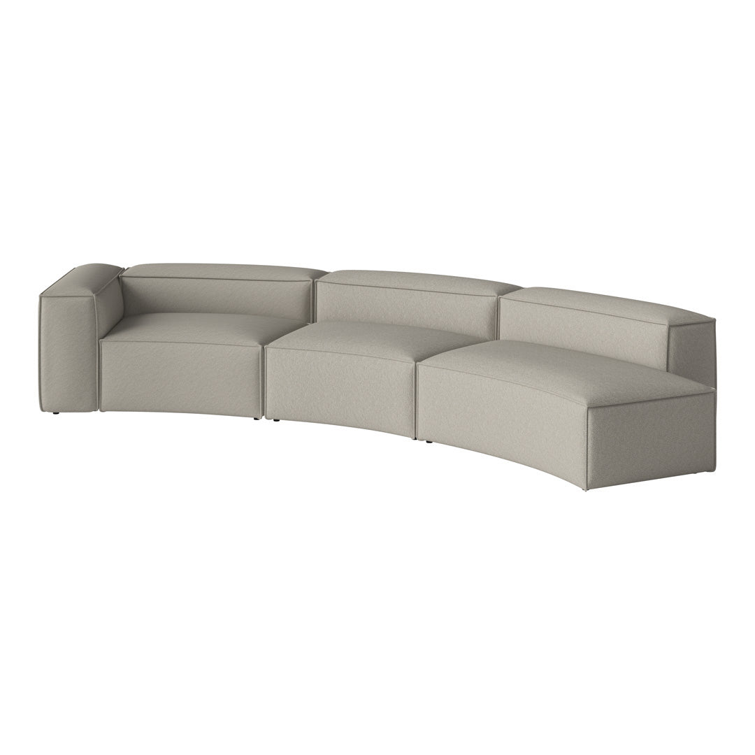 Curved sectional sofa in soft light gray fabric with smooth, seamless pattern for a modern aesthetic.