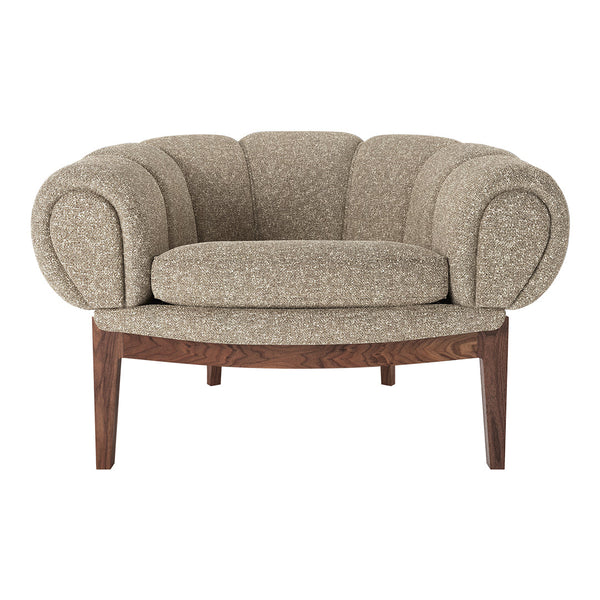 Beige textured fabric accent chair with rounded arms and a cushioned seat on a wooden base.