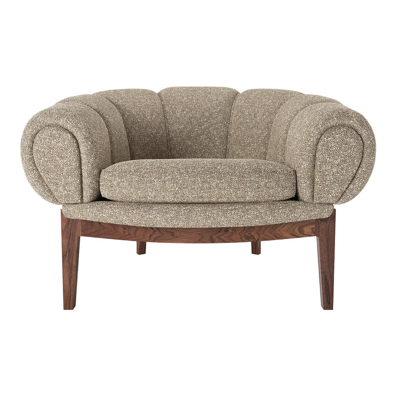 Beige textured fabric accent chair with rounded arms and a cushioned seat on a wooden base.