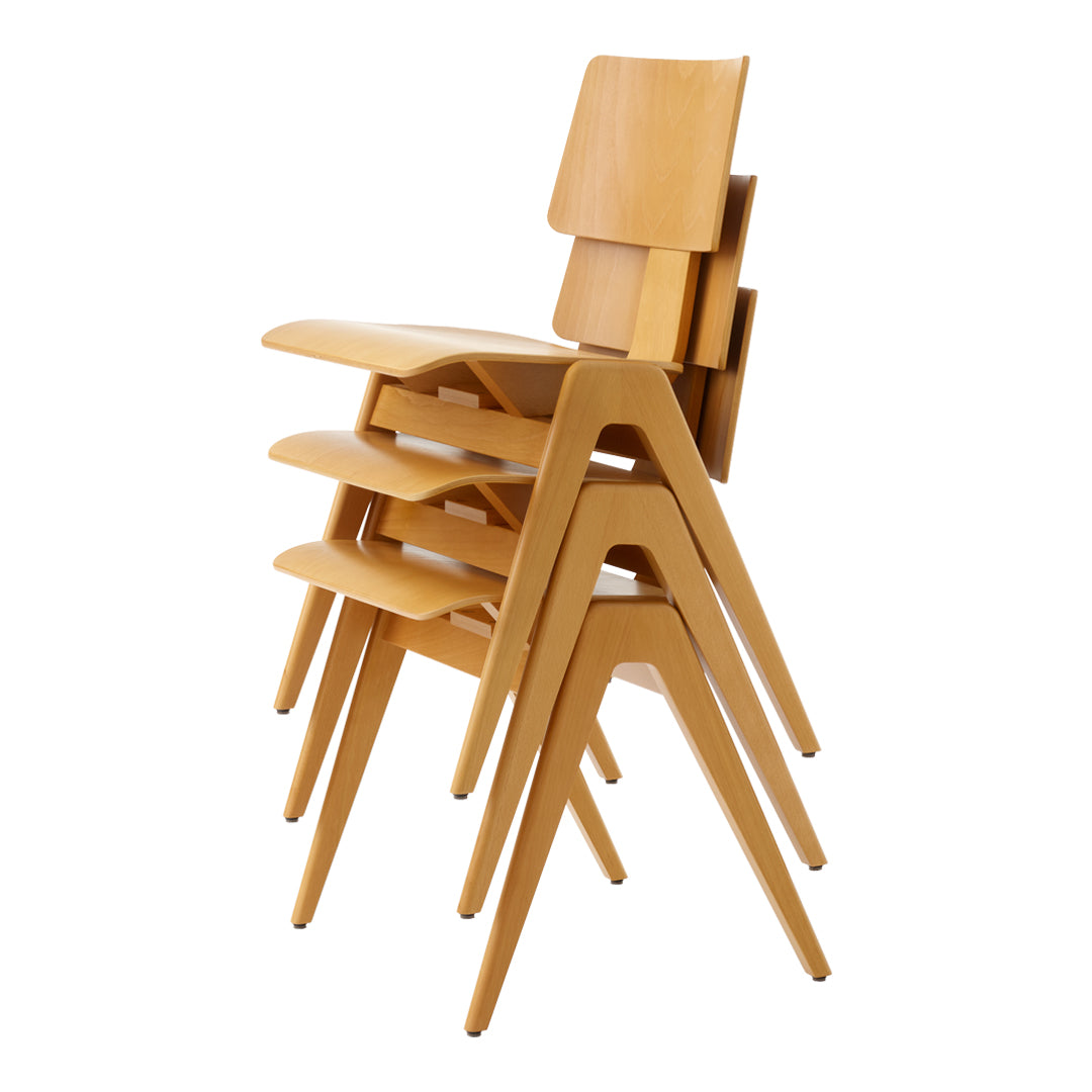 Stacked chairs in natural wood finish with smooth lines and a minimalist design, showcasing a warm, light color.