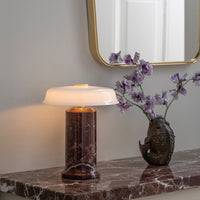 Modern marble lamp with a glossy white shade, featuring rich burgundy and veined patterns, perfect for elegant decor.