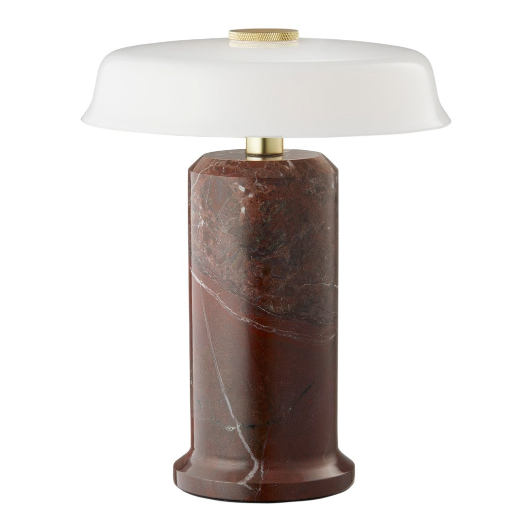 Elegant red-brown marble lamp base with a smooth white glass shade and brass accents, featuring sleek modern design.