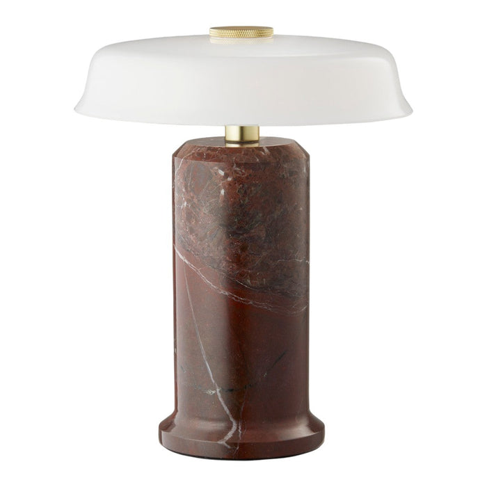 Elegant red-brown marble lamp base with a smooth white glass shade and brass accents, featuring sleek modern design.