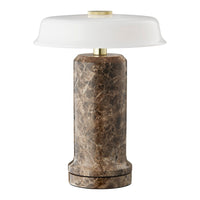 Round lamp featuring a textured brown marble base and a smooth white glass shade, adding elegance to any space.