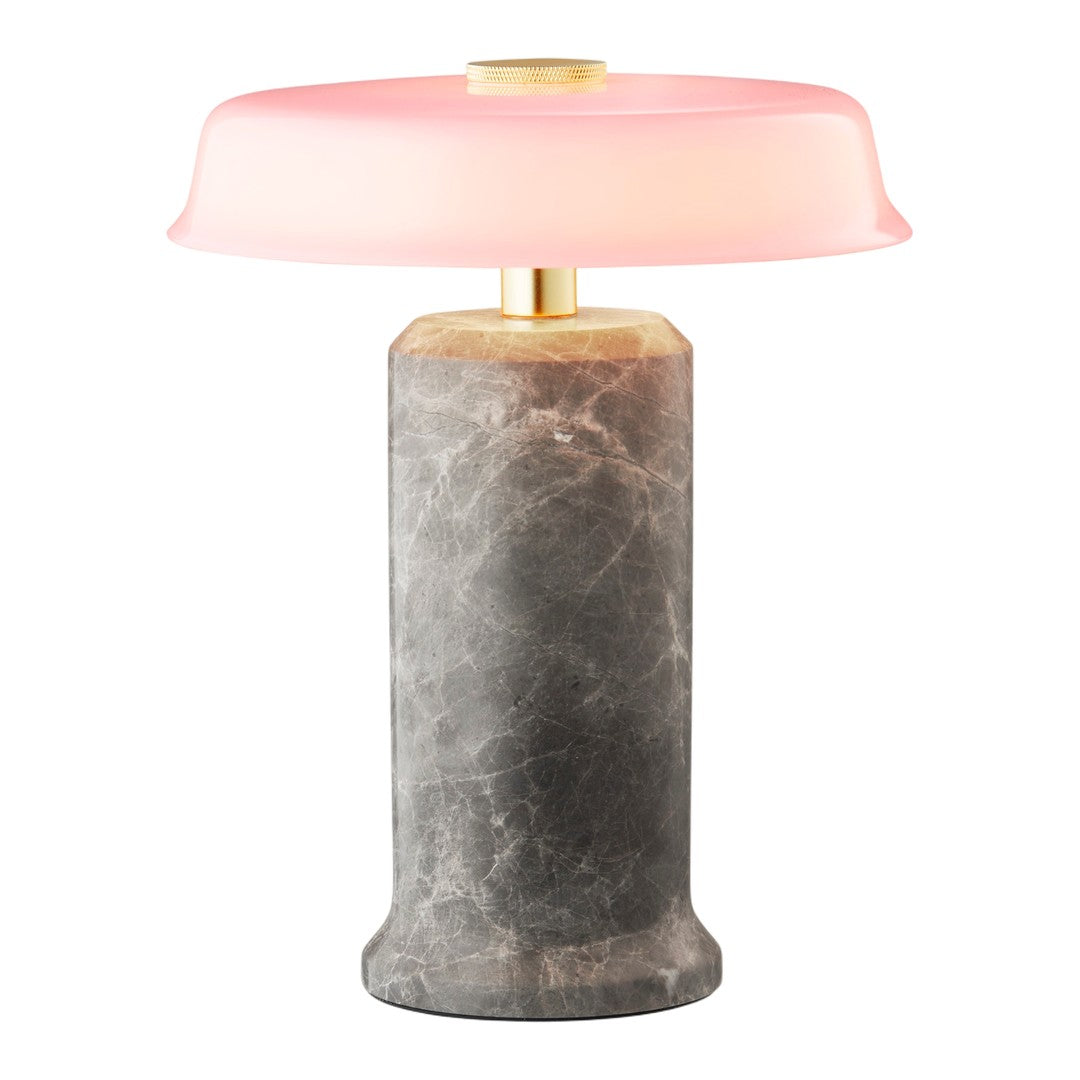 Stylish lamp featuring a gray marble base and a soft pink glass shade, accented with gold details.