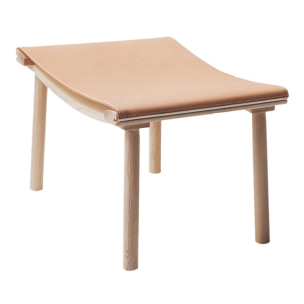 Light tan cushioned stool with a smooth surface and natural wood legs, showcasing minimalist design.