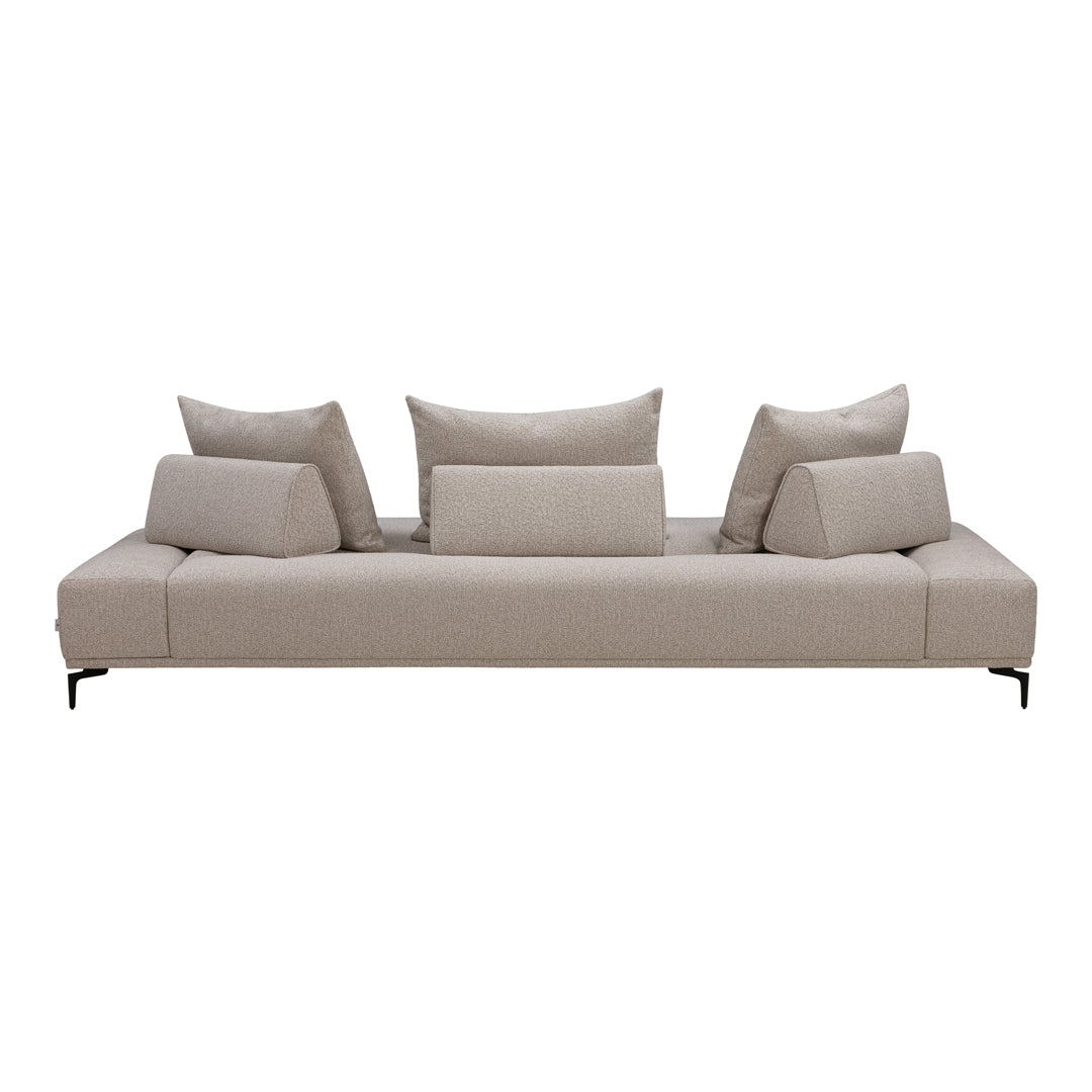 Modern beige sofa with textured fabric and plush, layered cushions for a cozy, contemporary look.