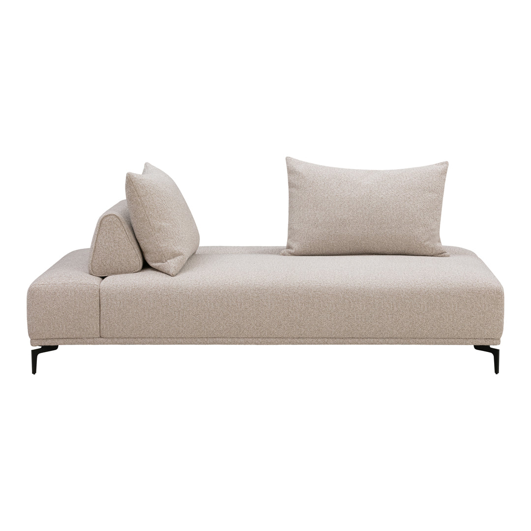 Light beige chaise lounge with subtle texture and two decorative pillows, featuring a minimalist design.