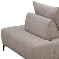 Beige fabric sofa with a subtle textured pattern, featuring a modern design and angled back cushions.