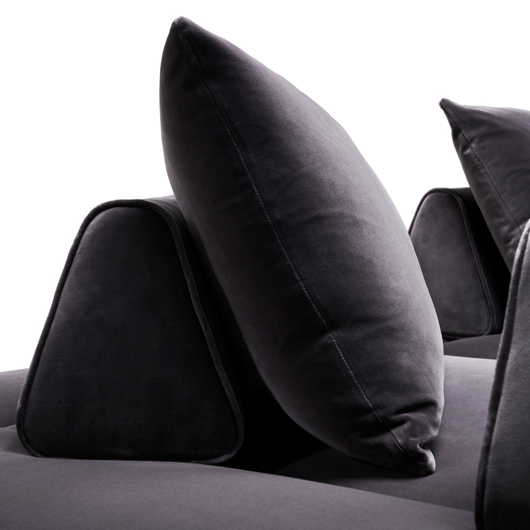 Dark gray velvet cushions with geometric shapes, creating a modern and stylish home decor accent.