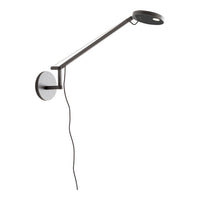 Sleek black and white wall lamp with a modern, minimalistic design and clean lines. Perfect for contemporary decor.