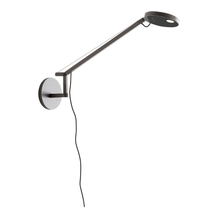 Sleek black and white wall lamp with a modern, minimalistic design and clean lines. Perfect for contemporary decor.
