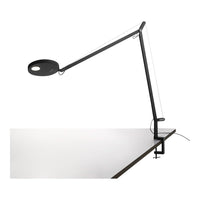 Black and white desk lamp with a minimalistic design and sleek lines, showcasing a modern aesthetic.