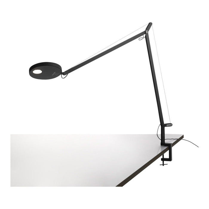 Black and white desk lamp with a minimalistic design and sleek lines, showcasing a modern aesthetic.