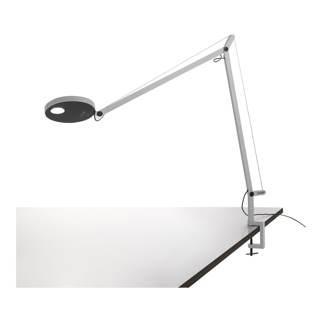 Modern white and black desk lamp with sleek, minimalist design and flexible arm. Ideal for contemporary workspaces.