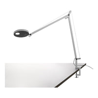 Modern white and black desk lamp with sleek, minimalist design and flexible arm. Ideal for contemporary workspaces.