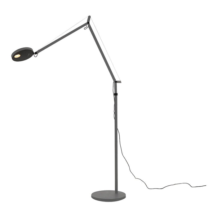 Sleek black and silver floor lamp with a modern, minimalist design featuring a smooth, circular base.