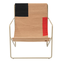 Tan chair with bold black and red geometric patterns on the seat. Modern and stylish design for contemporary decor.