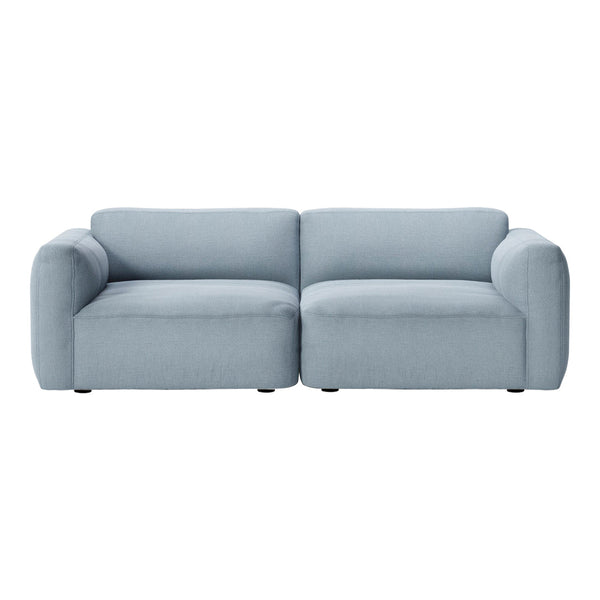 Light blue upholstered sofa with a smooth, modern design and minimalistic style. Perfect for contemporary interiors.