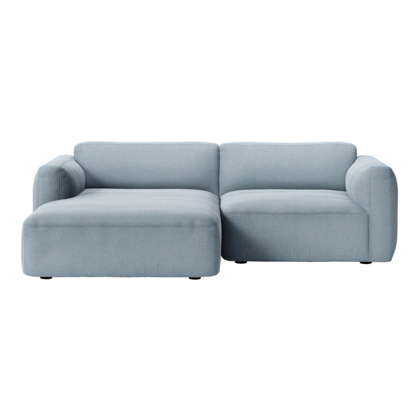 Light blue sectional sofa with a smooth, solid fabric pattern, perfect for modern living spaces.