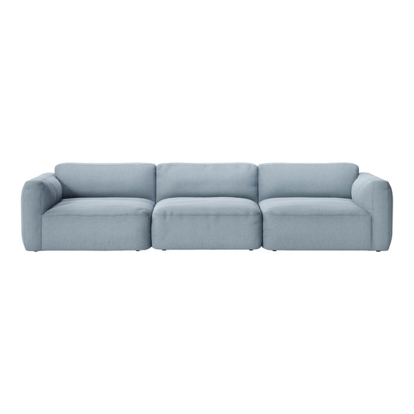 Light blue sectional sofa with a smooth, minimalist design and plush cushions, perfect for modern living spaces.
