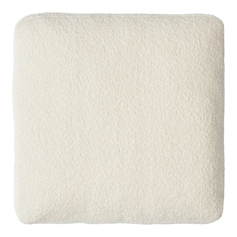 Soft cream cushion with a subtle textured pattern, perfect for adding a cozy touch to any space.