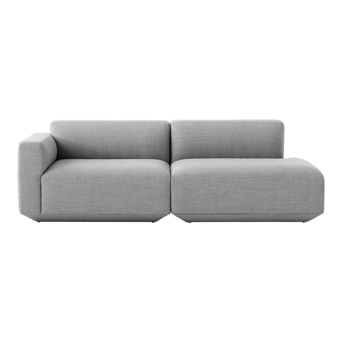 Modern two-toned grey sectional sofa with a sleek, minimalist design and textured fabric.