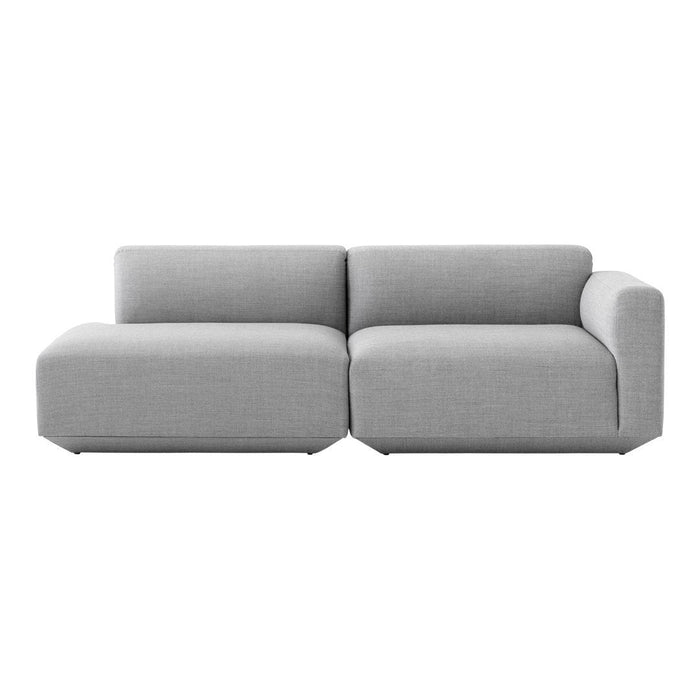 Gray fabric sectional sofa with a modern, minimalist design and clean lines. Ideal for contemporary living spaces.
