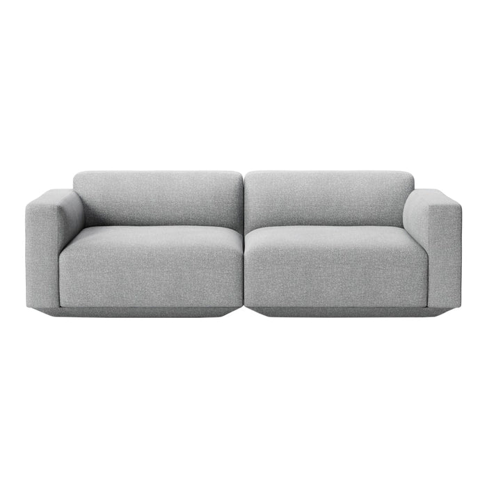 Light gray modular sofa with a minimalist design and smooth, textured fabric. Perfect for modern interiors.