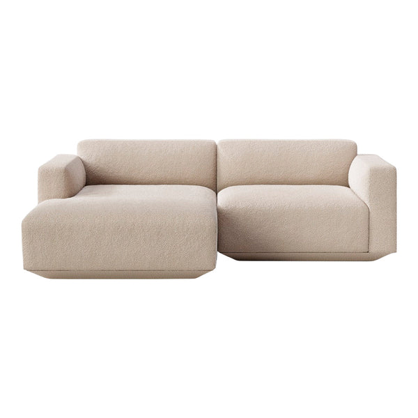 Light beige, textured fabric sectional sofa with modern lines and minimalist design. Ideal for contemporary spaces.