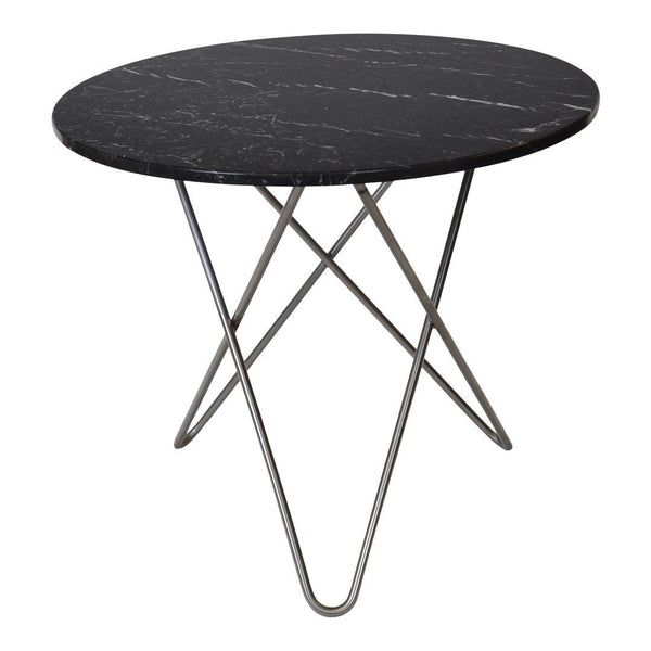 Round black marble table with subtle white veining and sleek silver metal tripod base. Modern design for any decor.