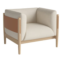 Beige and tan armchair with minimalist design and wooden frame, featuring geometric color blocking.