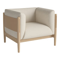 Light beige armchair with muted tan accents and minimalist design. Soft upholstery and natural wood frame.