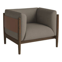 Gray upholstered armchair with brown leather accent and dark wood frame, featuring a modern, minimalist design.