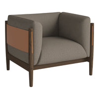 Gray upholstered armchair with a modern brown wooden frame and distinctive tan accent panel.