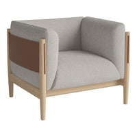 Gray and beige armchair with contrasting brown panel, featuring clean lines and natural wood legs. Modern design.