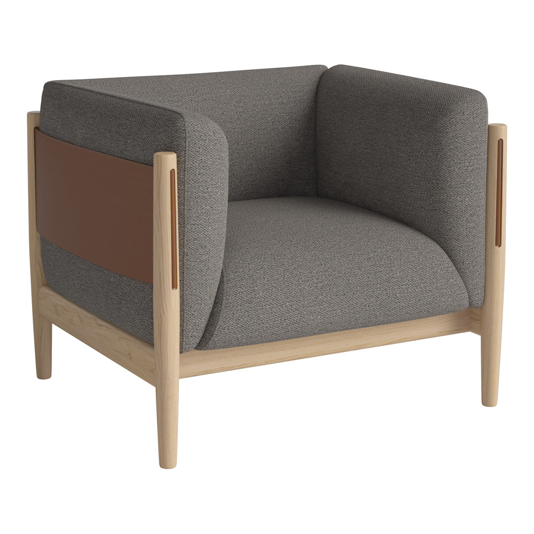 Gray upholstered armchair with brown leather accents and a light wooden frame, featuring modern, minimalist design.