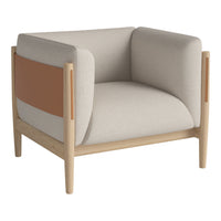 Beige armchair with tan accents and light wood frame, featuring a modern geometric design and minimalist style.