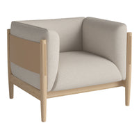Neutral beige and light tan armchair with a minimalist design, featuring smooth textures and clean lines.