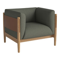 Modern armchair featuring dark green fabric and a contrasting brown accent, complemented by light wood legs.