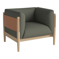 Green and beige armchair with a brown accent; minimalist design and modern color palette for stylish interiors.