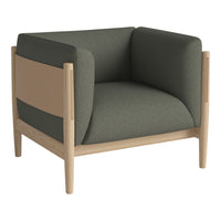 Modern armchair featuring a mix of dark green upholstery and light wood accents, creating a contemporary, minimalist look.